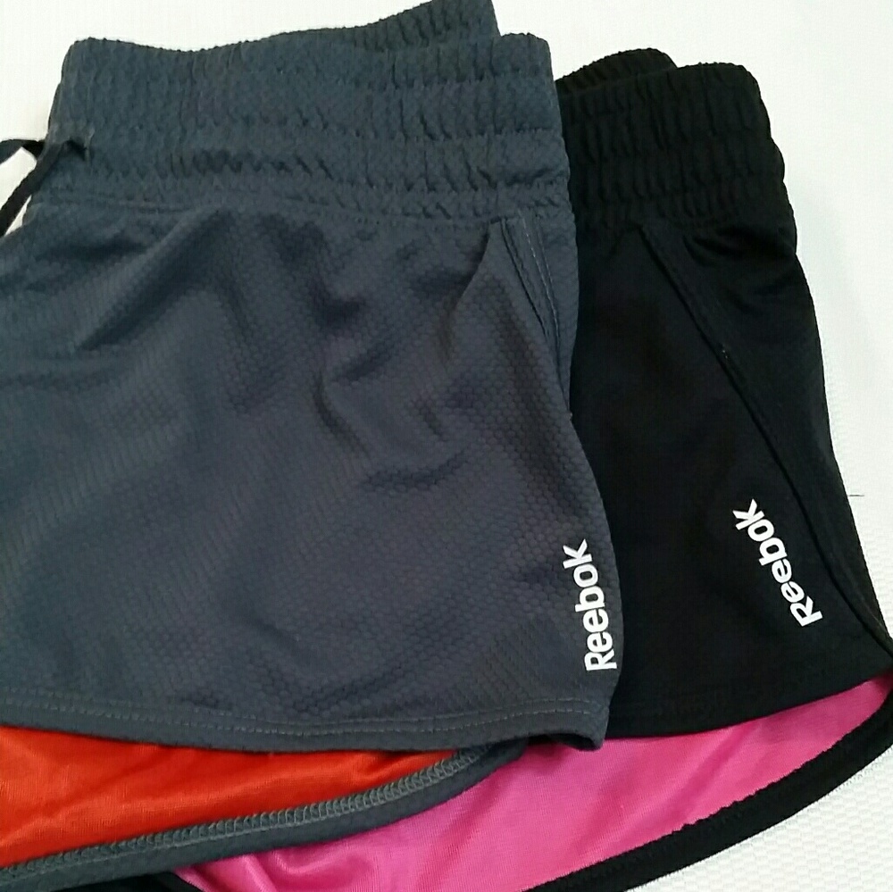Two reebok gym shorts.